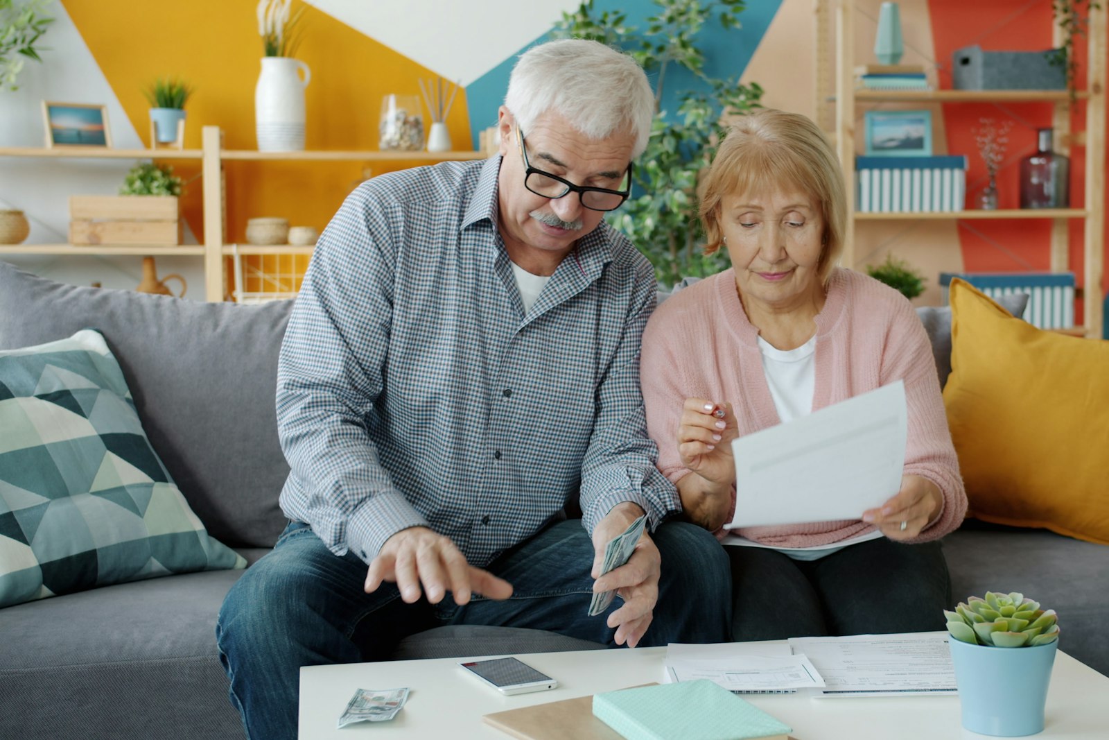 An older couple reviewing documents together at home
