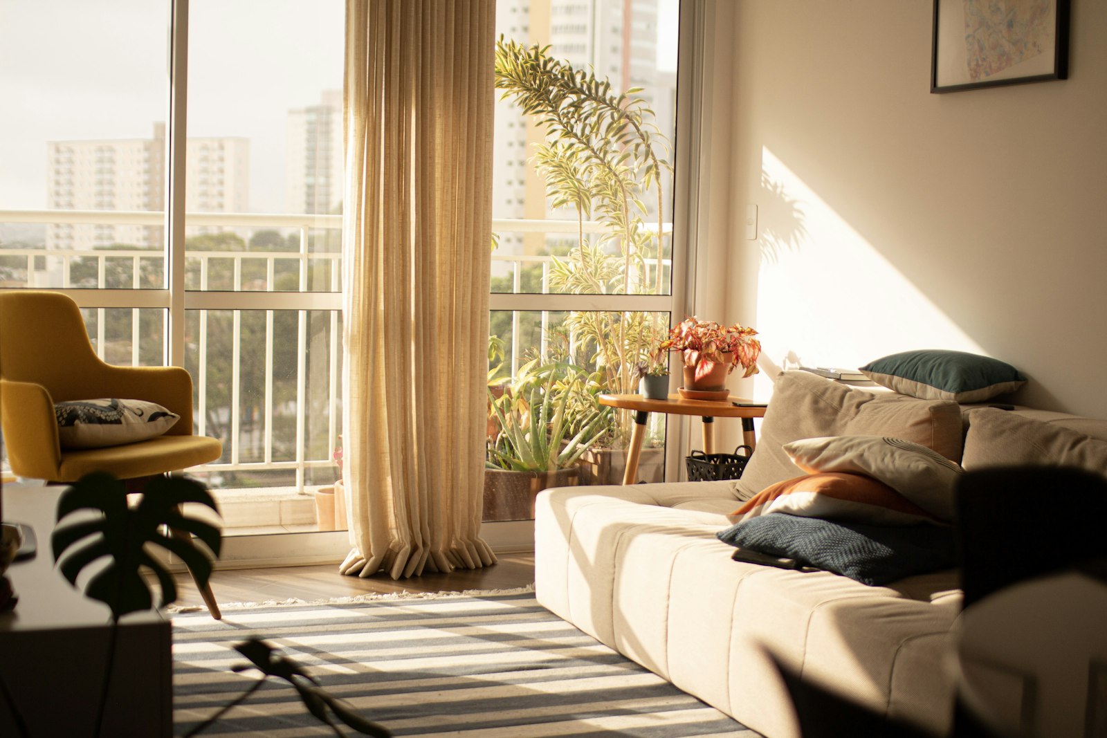 A bright apartment living room with a large window